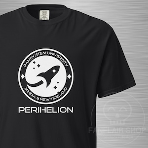 May include: Black t-shirt featuring a white circular design with the text "PANSYSTEM UNIVERSITY", a rocket ship graphic, and the words "MIHIRA & NEW TIDELAND". Below the design is the word "PERIHELION".