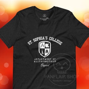 La materia oscura // El libro del polvo - St. Sophia's College - Camiseta unisex