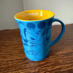 Disneyland Donald Duck Souvenir Mug Blue and Yellow Collectible Coffee Cup