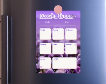 May include: A weekly planner with a purple floral background. The planner has spaces for each day of the week, a notes section, and spaces to write the month and week.
