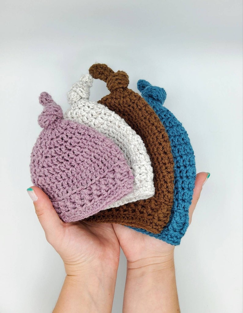 Top-Knot Baby Hat crochet pattern listing photo by FrostysTrinketsCo