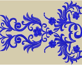 May include: A blue floral design with intricate swirls and leaves. The design is symmetrical and has a repeating pattern.