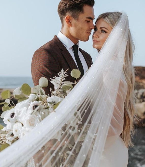 Wedding veil made of soft Italian tulle with pearls along the entire length, in one tier with a comb, ivory veil.