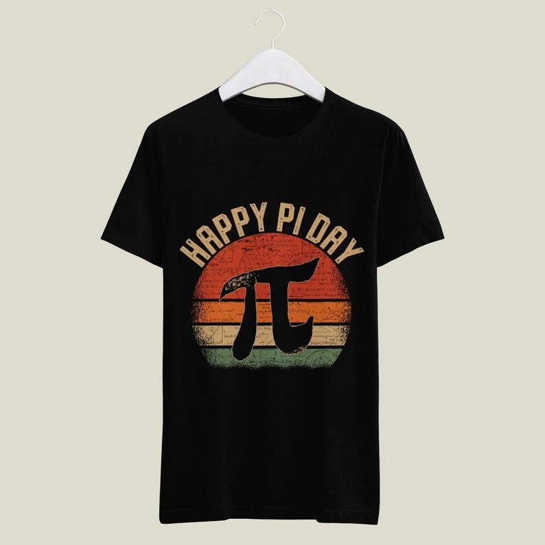 May include: Black t-shirt with a vintage-style graphic of a sunset with the text "Happy Pi Day" and the mathematical symbol for pi.
