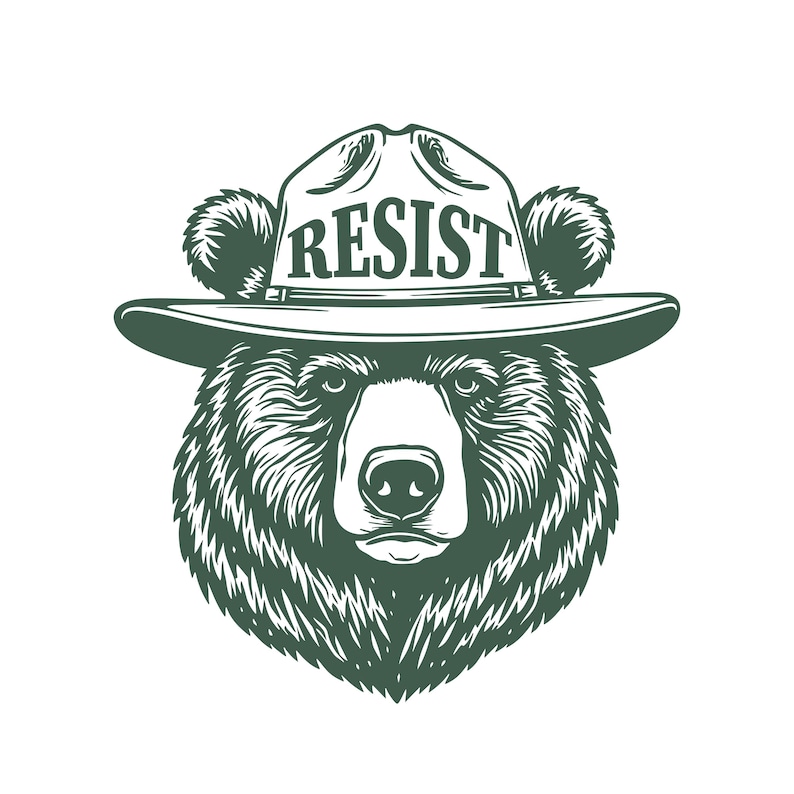 May include: A black and white illustration of a bear wearing a ranger hat with the word "RESIST" printed on the front.