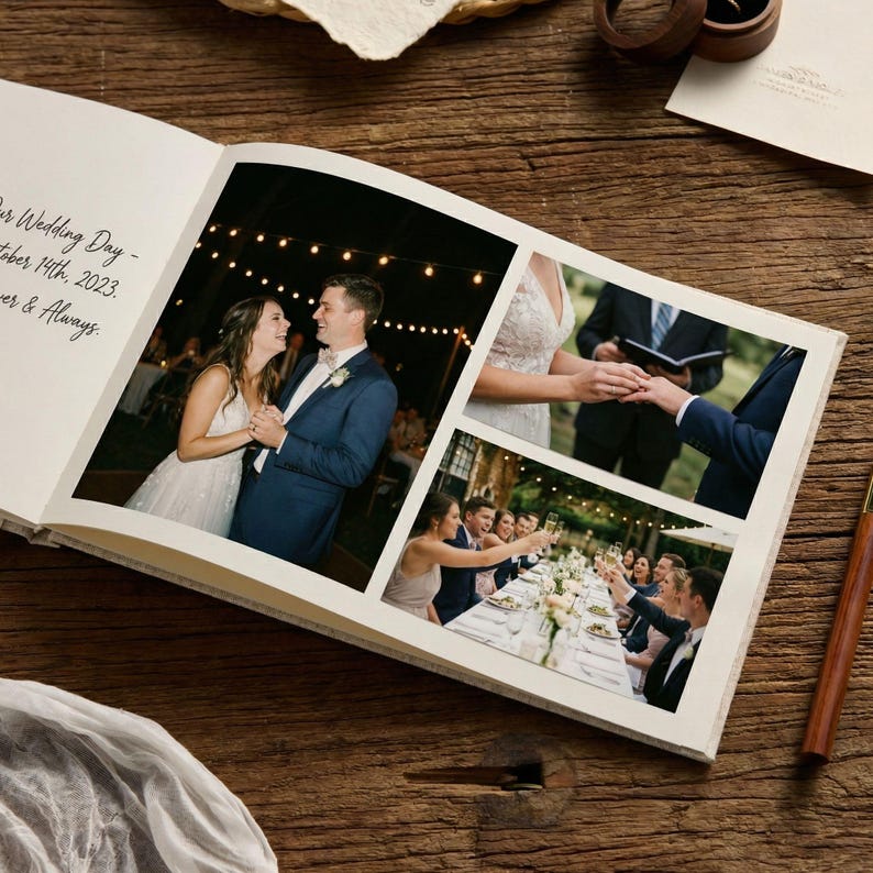 May include: A wedding photo album open on a wooden surface. The album displays three photographs: a couple dancing, a ring exchange, and a group toasting at a reception. The album's left page has handwritten text.