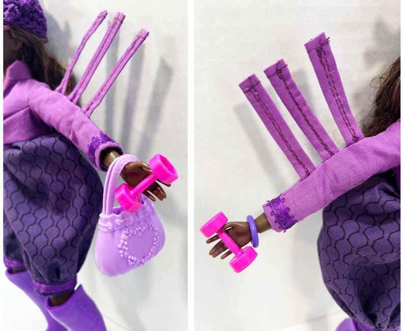 May include: A doll in a purple ensemble, holding a pink dumbbell and a lavender handbag. The doll's outfit includes a long-sleeved top, a skirt with a geometric pattern, and a matching hat. The handbag features a heart-shaped design.
