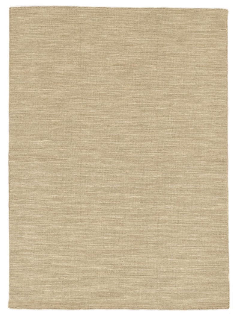 May include: A beige area rug with a subtle woven texture. The rug has a light, neutral colour and a smooth, even surface.