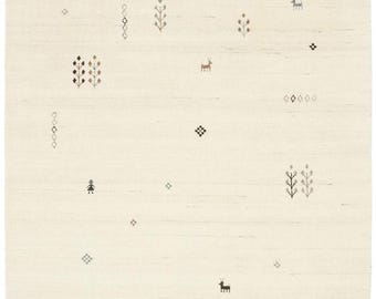 May include: A cream-colored rug with a subtle woven pattern featuring small trees, deer, and geometric shapes in shades of brown, black, and blue.