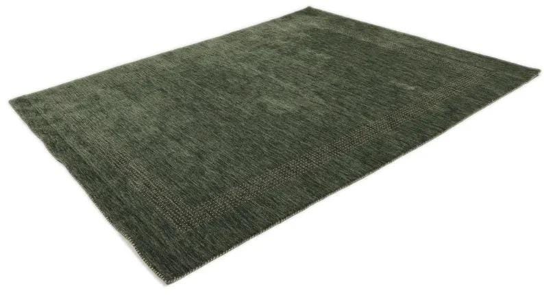 May include: A rectangular, green area rug with a textured surface. The rug has a darker green border with a subtle pattern. The rug is displayed on a white background.
