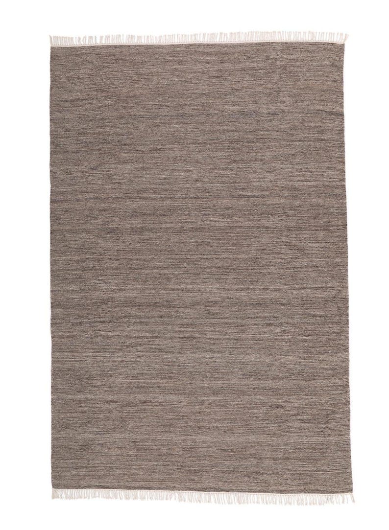 May include: A brown area rug with a subtle striped pattern and a white fringe border.