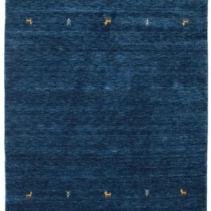 May include: A deep blue rug with a repeating pattern of small white trees and yellow deer.