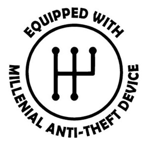 May include: A black and white graphic with the text "Equipped With Millennial Anti-Theft Device" encircling a gear shift symbol. The design is circular and bold, suitable for stickers or apparel.
