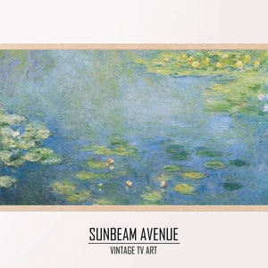 May include: A framed print of a painting depicting a pond with water lilies and lily pads. The water is a light blue color and the lily pads are green. The painting is in a light wood frame.