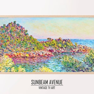 May include: A colorful painting of a seascape with a rocky coastline and a body of water. The painting is done in a style reminiscent of Impressionism, with visible brushstrokes and a vibrant palette. The colors are mostly blues, greens, and yellows, with hints of pink and purple. The painting is framed in a light wood frame.