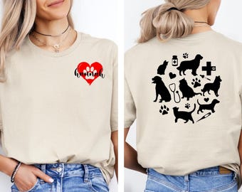 May include: A beige t-shirt with a red heart and the word "hannah" on the front. The back of the shirt has a black silhouette design of a dog, cat, and other pet-related items.