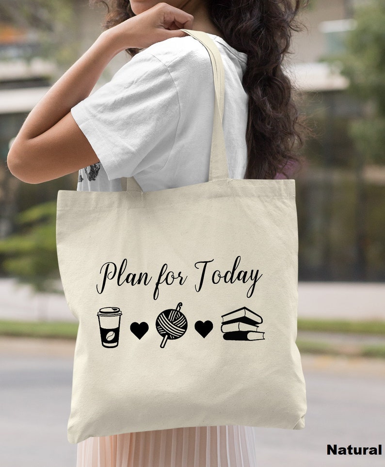 May include: A natural canvas tote bag with the text "Plan for Today" printed in black. The bag features a coffee cup, yarn ball, and stack of books with hearts between each item.
