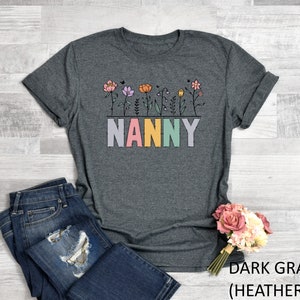 a t - shirt that says nanny with flowers on it