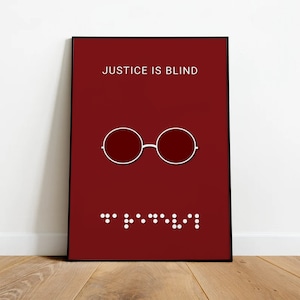 May include: A red poster with the text "JUSTICE IS BLIND" in white. A white outline of round glasses is centered on the poster. Below the glasses is a line of braille dots in white.