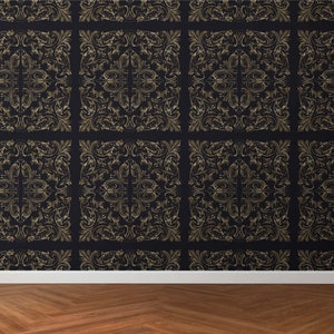 May include: Dark navy wallpaper with a repeating gold baroque pattern. The ornate design features swirling leaves and floral elements within a grid. The wallpaper is installed above a white baseboard and a wooden floor.