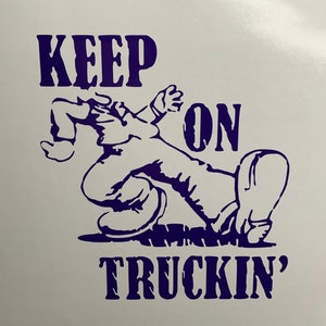 May include: Purple vinyl decal with a cartoon figure and the text "KEEP ON TRUCKIN'"