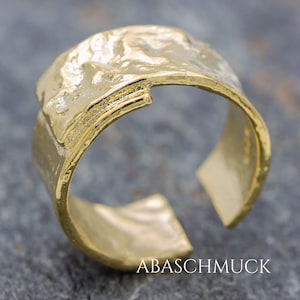Textured, wide ring made of gold-plated 925 silver – modern, open-designed band ring for women in an organic style