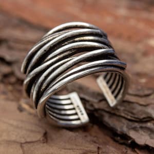Wide adjustable sterling silver ring with bold organic wavy design, modern statement silver band with sculptural texture