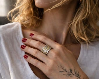 Adjustable sterling silver ring with gold star details, wavy textured band, celestial statement jewellery, nickel-free artisan design