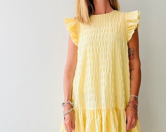 Sewing Digital Pattern - Short sleeve ruffle dress // PDF pattern short sleeve dress with flaps and ruffle skirt #themajadress