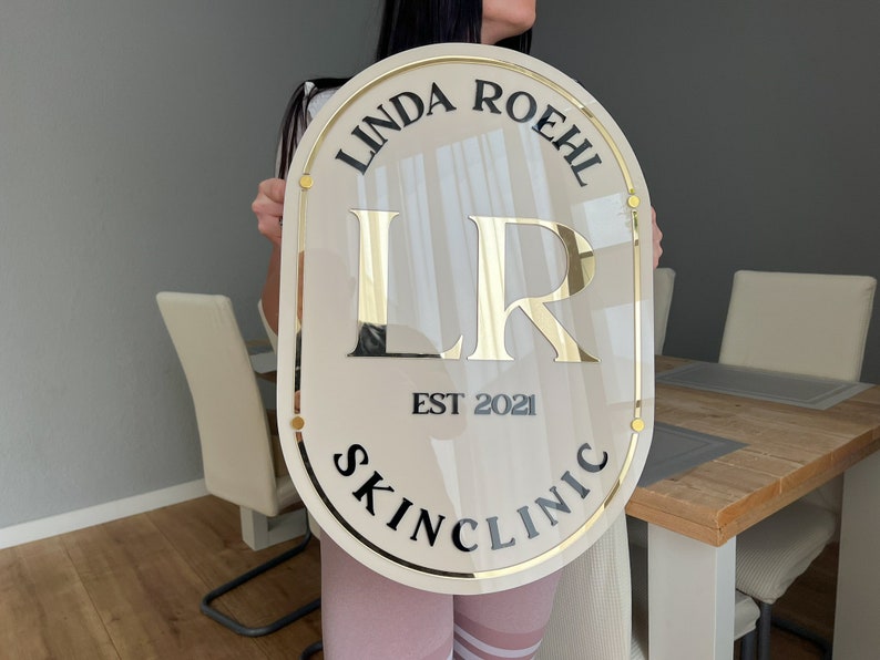 Beige Oval Sign With Golden and Black Letters, Golden Lining, Mounting ...