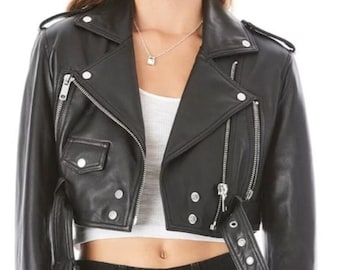 May include: A black leather cropped moto jacket with a zipper closure, multiple pockets, and a belt at the waist.