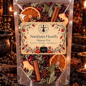 May include: A clear plastic pouch filled with a dried botanical blend including orange slices, cinnamon sticks, star anise, and herbs. The label reads Samhain Hearth Simmer Pot, Ancestors, Protection, Remembrance, with a cauldron illustration.