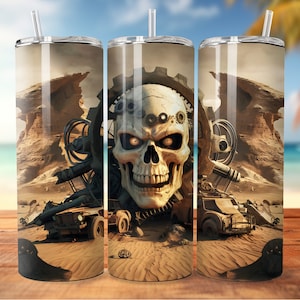 May include: A stainless steel tumbler with a desert scene featuring a skull with gears, a rusty vehicle, and rock formations. The tumbler has a straw.