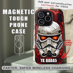 May include: A black phone case with a red and white illustration of a Star Wars Stormtrooper helmet. The case has a magnetic ring on the back for wireless charging. The text "TK-BADA5" is printed on the case.