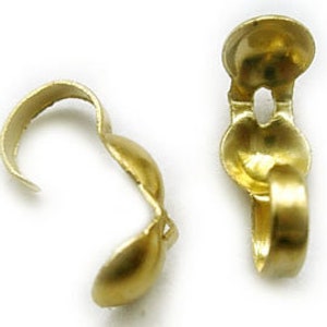 May include: Gold-toned metal clasps for jewelry making. The clasps are designed to be used with chain or cord.