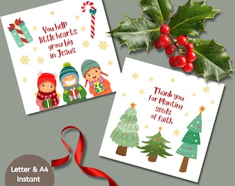 May include: Two Christmas-themed greeting cards with illustrations and text. One card features three children and the text "You help little hearts grow big in Jesus." The other card shows three Christmas trees and the text "Thank you for Planting seeds of faith."