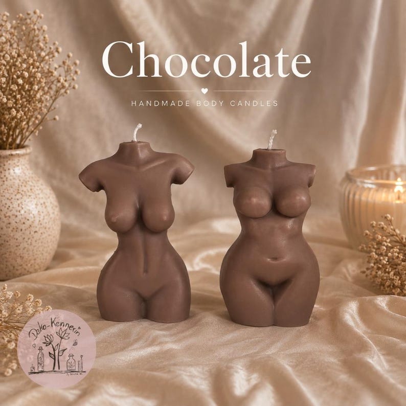 May include: Two brown torso-shaped candles with a single wick at the top of each. The candles are positioned side by side. The text "Chocolate" and "HANDMADE BODY CANDLES" is visible at the top, and a circular logo is in the bottom left corner.