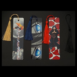 May include: Set of five colorful bookmarks with tassels. Each bookmark features a different anime character and design. The bookmarks are made of sturdy cardstock and are perfect for marking your place in a book.