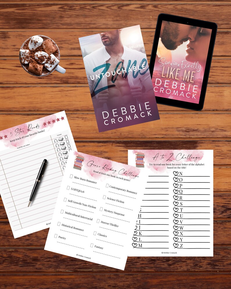 May include: A set of printable reading challenge cards with pink and white watercolour backgrounds. The cards feature a list of genres and a list of letters of the alphabet. The text on the cards reads "Genre Reading Challenge" and "A to Z Challenge".