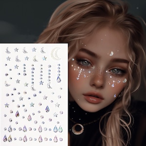 May include: A sheet of iridescent face gems featuring stars, moons, and teardrop shapes. The gems are in various sizes and are designed to be applied to the face for a decorative effect. The image also shows a person with similar gems applied to their face.