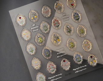 May include: A sheet of clear stickers with gold frames and colorful floral and insect illustrations. The stickers feature quotes like "Digging for the beauty of life on your own" and "Life should belong to yourself".
