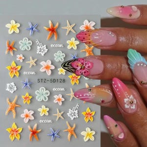 Puede incluir: Lámina de pegatinas para uñas con diseños temáticos del océano. Incluyen estrellas de mar, flores y la palabra "ocean". La paleta de colores incluye naranja, amarillo, azul y blanco. El código de producto "STZ-5D128" es visible.