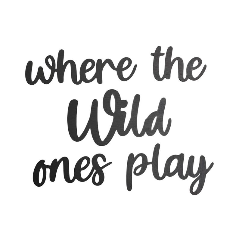 May include: Black script text on a white background reads "where the Wild ones play." The phrase is in a cursive font, perfect for wall decor or a nursery. The words are in a bold, dark color.