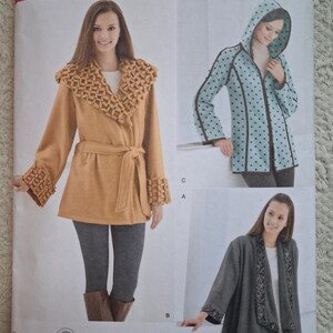 May include: Simplicity sewing pattern 2208 for jackets in sizes XS, S, M, L, and XL. The envelope displays three jacket variations: a mustard yellow belted jacket with textured trim, a light blue hooded jacket with dark polka dots, and a gray open-front jacket.