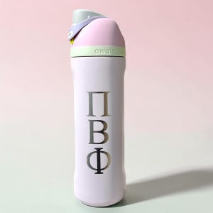 May include: A light purple Owala water bottle featuring a silver metallic Greek letter design of Pi Beta Phi vertically on the front. The bottle has a multi-colored lid with pastel pink, light green, and grey accents and a carry loop.