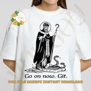 May include: White t-shirt featuring a black and white illustration of a robed figure with a halo, holding a staff, and standing near two snakes. The text "Go on now. Git." is below the image.