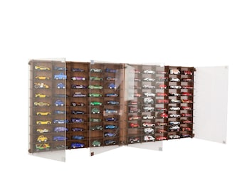 May include: A wooden wall-mounted display case with glass doors for storing and displaying a collection of toy cars. The case has multiple shelves and is filled with colourful toy cars.