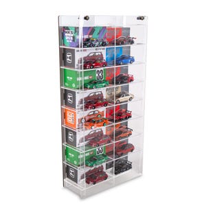 May include: A clear acrylic display cabinet showcasing a collection of miniature toy cars. The cabinet features multiple shelves, each displaying model cars in various colours and designs. Some shelves also hold boxes with text and logos.