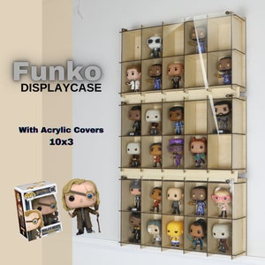 Peut inclure: Une vitrine en bois avec des couvercles en acrylique pour les figurines Funko Pop. La vitrine mesure 25,4 cm de large et comporte 3 étagères. La vitrine est remplie de diverses figurines Funko Pop, notamment des personnages de Harry Potter, Marvel et Star Wars.