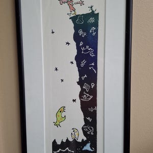 May include: Framed art print with a quirky illustration of a person leaping from a cliff. The artwork features stylized creatures and stars, with the text "Man jumping to his own conclusion". The print is in a black frame.